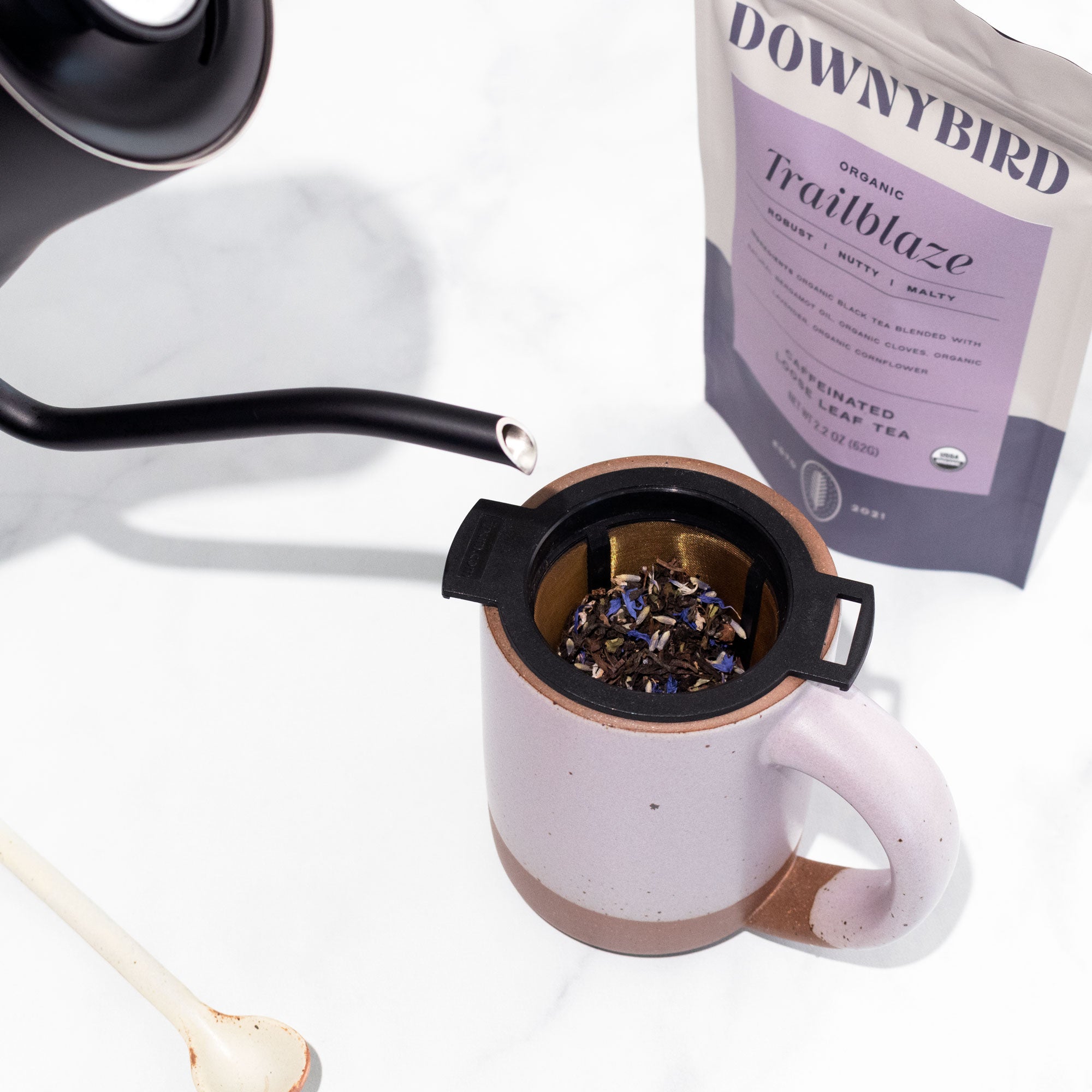 Finum Reusable Tea Brewing Basket with Downybird Trailblaze Organic Earl Grey Loose Leaf Tea Steeping in Mug