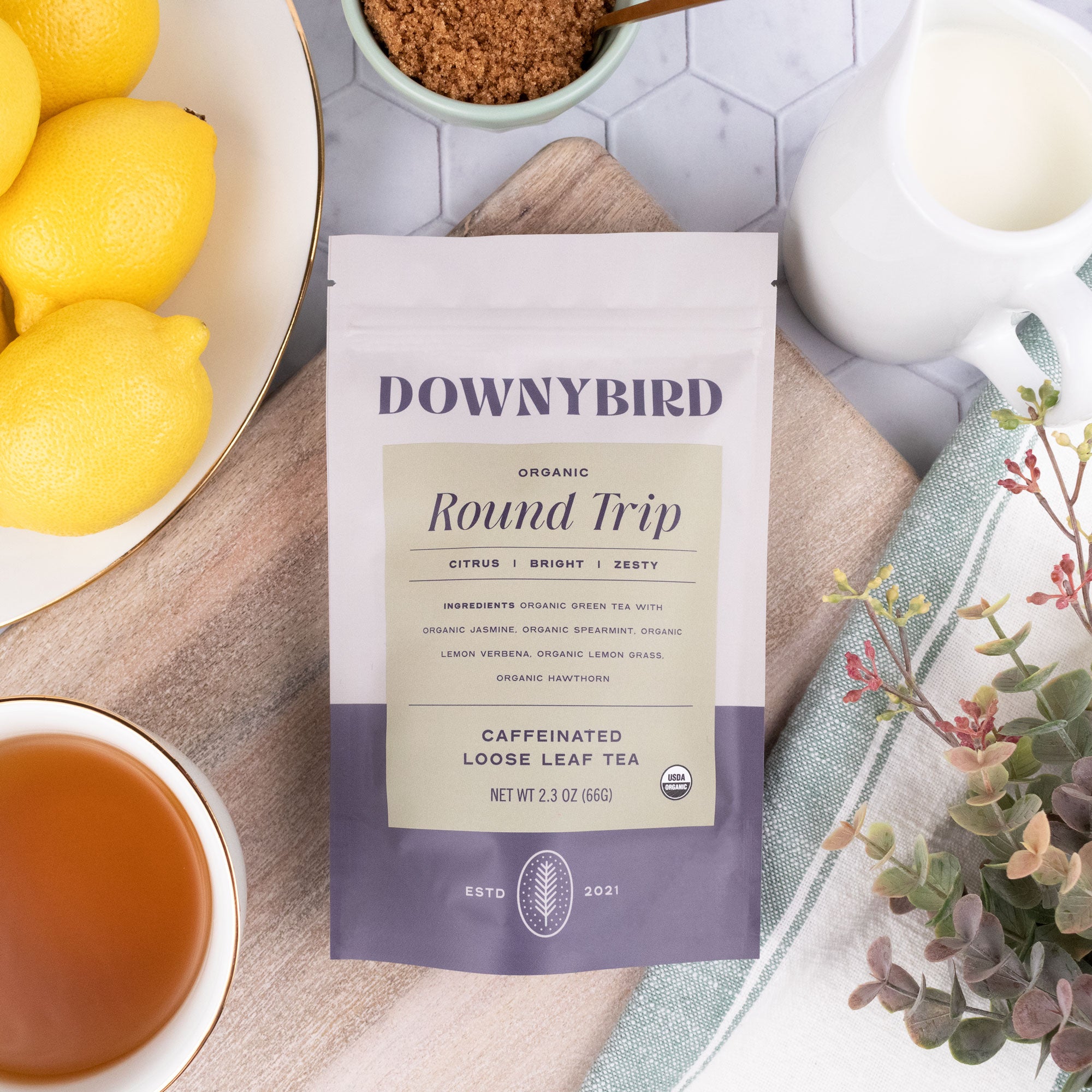 Downybird Round Trip Blend Organic Jasmine Green Tea Loose Leaf Tea Pouch on Table